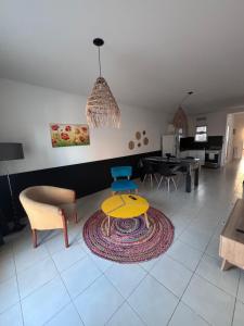 a living room with a couch and a table at La Serenité en Puerto Madryn in Puerto Madryn