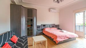 a bedroom with a large bed and a chair at Monte la Torre in Santander