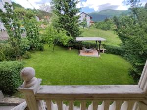 a balcony with a yard with a gazebo at Apartment Green Garden in Sarajevo