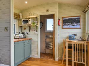 a kitchen in a tiny house with a counter at The Rams Rest - Uk48823 in Kirby Misperton