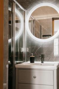 a bathroom with a sink and a mirror at U Bochniaka in Czorsztyn +147 photos