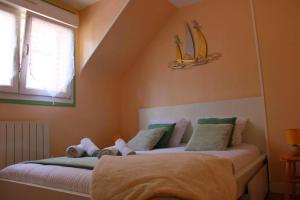 a bedroom with two beds and a window at Studio LS - Plage, falaise, Funiculaire, in Le Tréport