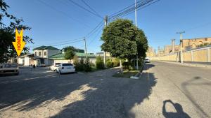 a street with cars parked on the side of the road at Private 3BR House 2 Min Walk to Registan in Samarkand