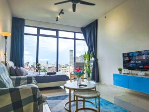 a living room with a couch and a table at Beacon Executive Suite by NGN - Georgetown Penang in George Town