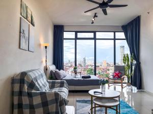 a living room with a view of a city at Beacon Executive Suite by NGN - Georgetown Penang in George Town