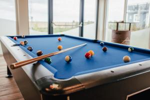 a pool table with billiard balls on it at NUR Camping Stellplatz OHNE Zelt oder Wohnwagen sowie Schlaffässer in Groß Kordshagen