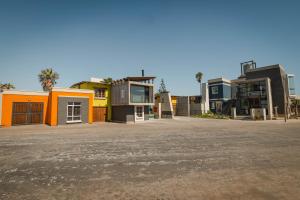 a group of buildings in a parking lot at de Baken Self-Catering in Walvis Bay