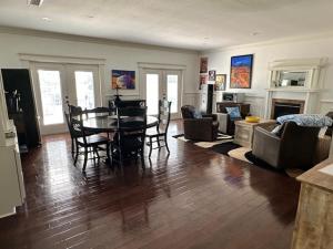 a large living room with a table and chairs at Deluxe Farm Studio Apt with Pool View in Alachua