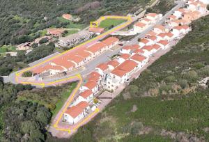 an aerial view of a train yard with houses at Costa Silvia Villaggio Frisaia Vue imprenable sur la mer avec piscine in Trinità d'Agultu e Vignola