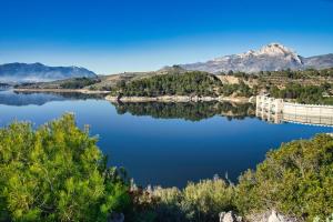 a view of a river with mountains in the background at Ca Salvadora in Beniarrés