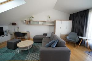a living room with a couch and a table at Premium Apartment Maj **** in Poreč