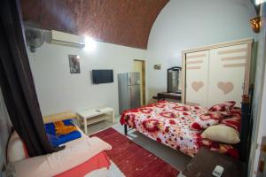 a small bedroom with a bed and a mirror at Sunny sea in Quseir
