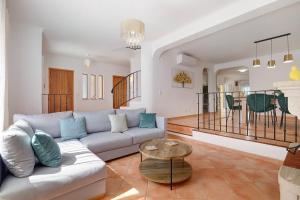 a living room with a couch and a table at Modern Villa In Olhao in Quelfes