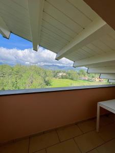 a window in a room with a view of a field at I tre platani in Marina di Massa