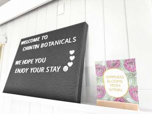 a sign on the side of a building at Gem on the Hill by Tiny Away in Romsey