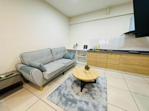 a living room with a couch and a table at Evo studio soho mini apartment in Bandar Baru Bangi