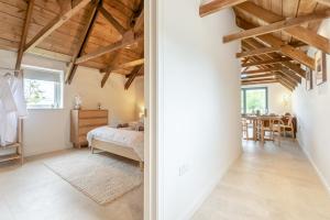 a bedroom with a bed and a dining room at 2 Bed in Blakeney oc-m42455 in Awre +30 photos