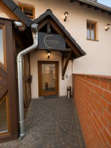 a front door of a building with a sign on it at Hotel Eurocity in Bruchköbel