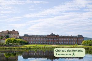 a large building with a sign in front of it at L'Atelier de Tropique in Saverne +9 photos
