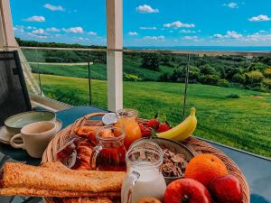a tray of food on a table with fruit and other foods at Meraki Nikiti in Nikiti +20 photos