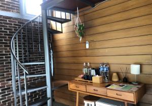 a room with a wooden wall and a wooden desk at villa tibra in Lembang +75 photos