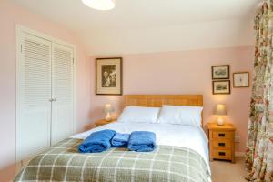 a bedroom with a bed with two towels on it at 3 Bed in Coldstream oc-c39085 in Coldstream