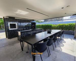 a dining room with black tables and chairs at Flats Unity Cabo Branco - By EasyHost in João Pessoa
