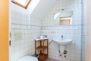 a bathroom with a sink and a toilet at Kiek Över in Ahrenshoop