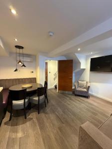 a living room with a table and a couch at EPIC Apart Hotel, Duke Street, Central Liverpool Apartments Near Liverpool ONE in Liverpool