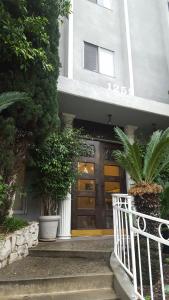 a entrance to a building with a door and plants at Great Getaway Steps to Bev Hills in Los Angeles