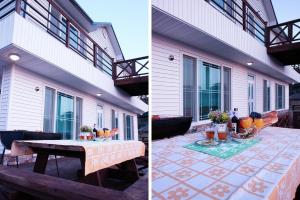 two pictures of a house with a table on a patio at Buan Solseom House Pension in Buan