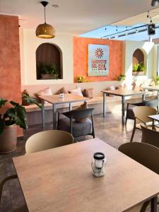 a restaurant with tables and chairs in a room at Hotel Terrazas del sol in Arequipa