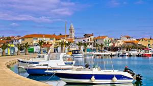 a group of boats are docked in a marina at Holiday Home Pakoštane in Pakoštane