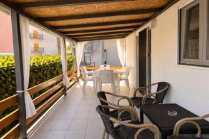 a balcony with a table and chairs on it at Holiday Home Pakoštane in Pakoštane