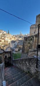 a view of a city with stairs and buildings at Vistasassi rooms in Matera