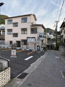 an empty parking lot in front of a building at 小宿 和Nagomi in Kobe