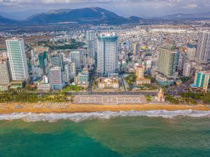 an aerial view of a city with a beach at The Atier Gem Suites in Nha Trang