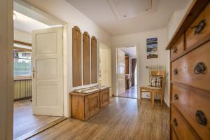 a room with a closet with a wooden dresser in it at Apartments Smidl in Ortisei +149 photos