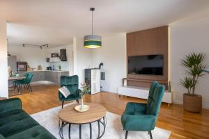 a living room with a couch and chairs and a table at Aurea Lika - Gospic in Gospić