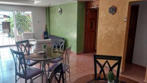 a dining room with a table and some chairs at Hotel Calle 6 in Bocas Town +25 photos