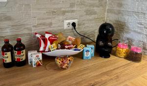 a counter with a bunch of food and a telephone at Casa via veneto in Carbonia
