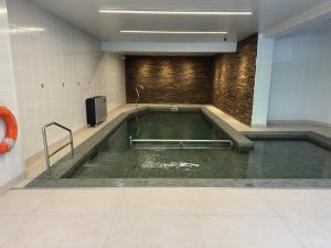a large pool of water in a room at Hotel Recanto da Serra in Gramado
