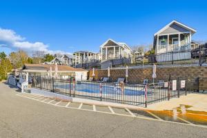 a fence in front of a row of houses at Pool & Lake Access! Sherrills Ford Tiny Home in Sherrills Ford