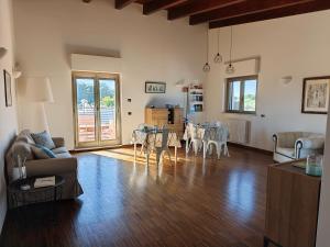 a living room with a couch and a table at B&B Valleluna in Trani