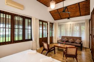 a living room with a couch and a table at Serenity Lake Front Villa in Moratuwa