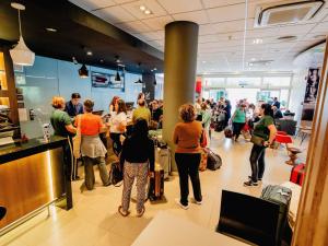 a crowd of people standing in a store at ibis Asuncion in Asunción