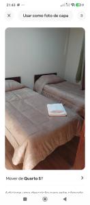 a picture of two beds in a room at Quarto Meudon in Teresópolis