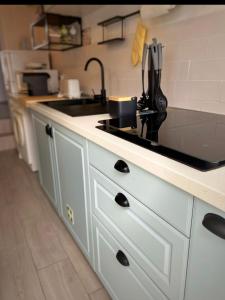 a kitchen with a sink and a counter top at A Casinha in Portel