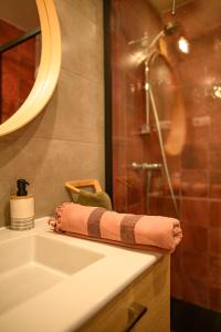 a bathroom with a sink and a shower at Amama Baita in Urrugne +81 photos