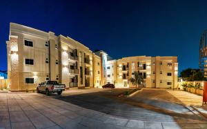 a building with a car parked in front of it at Citistay Apartments in Abuja